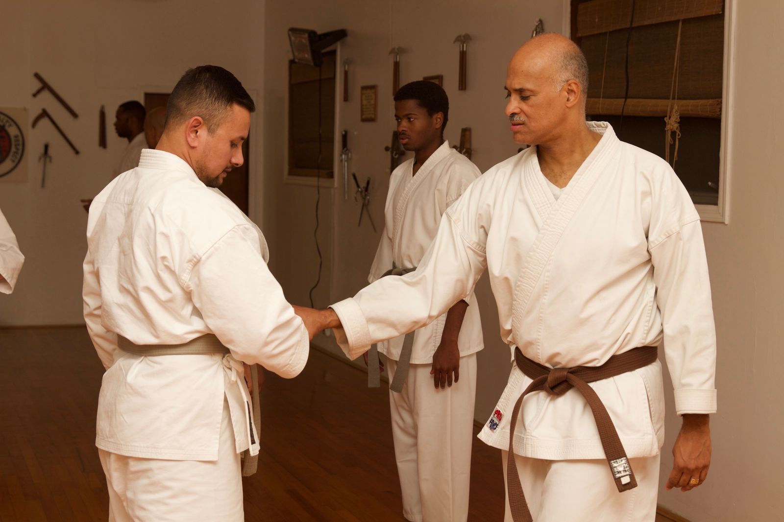 Ron J. Wiggins demonstrating a wrist-control technique with students