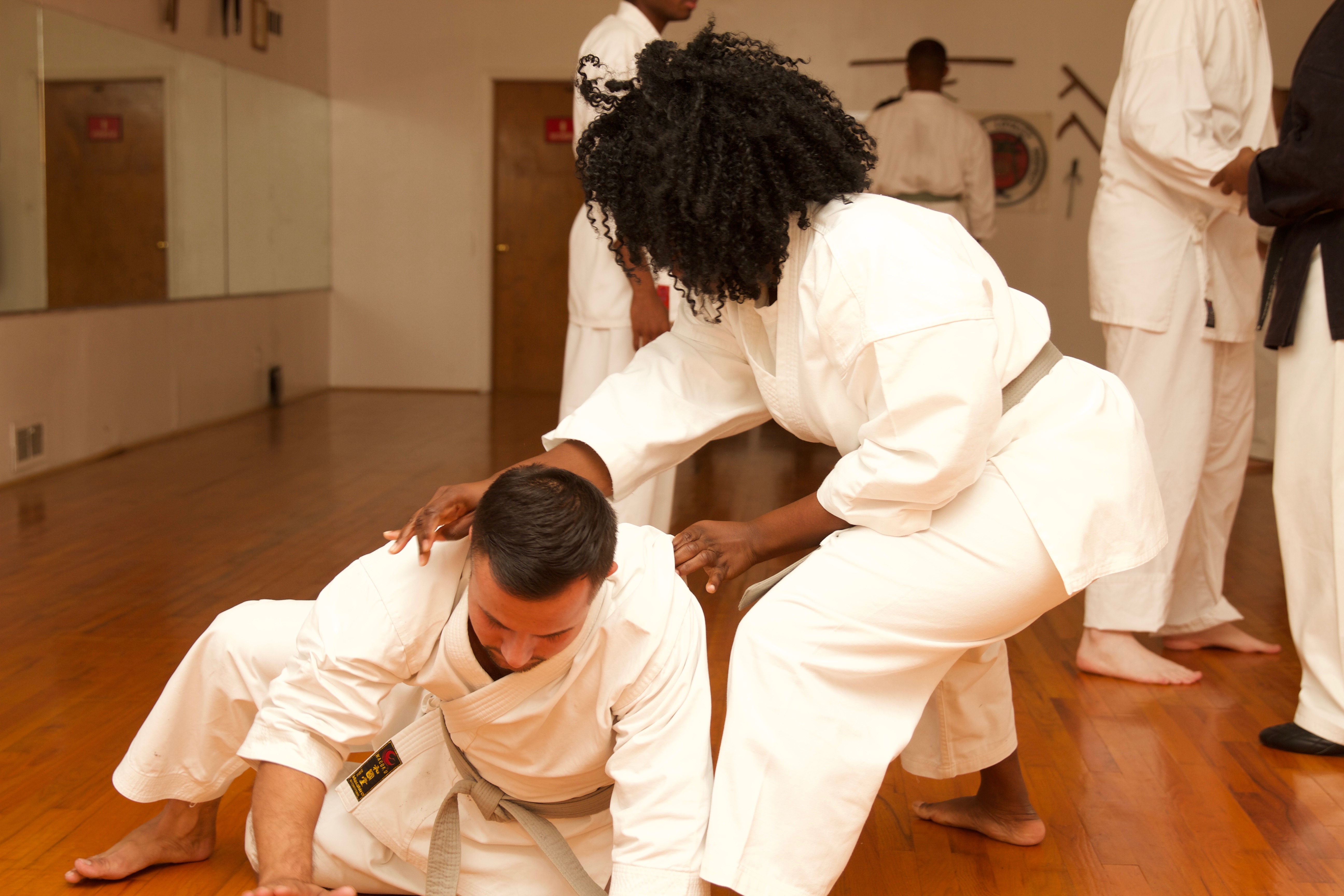 Student applying a ground control technique during self-defense training