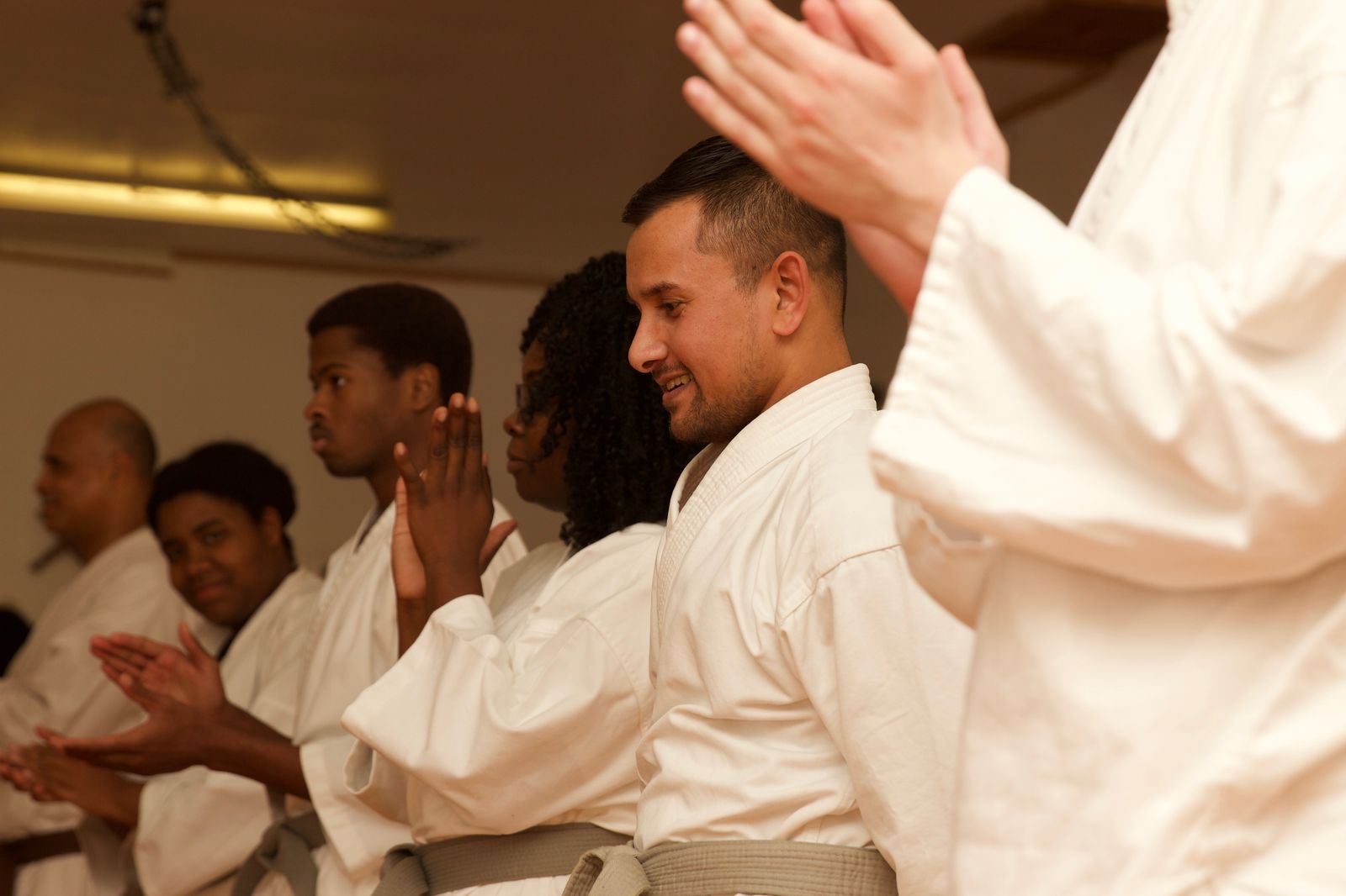 ShareLearn WAY students and instructor applauding after a training session